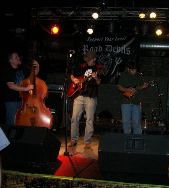 HTH performing with Road Devils banner